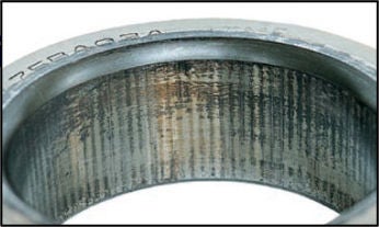 Fretting damage on the inner ring of a bearing.