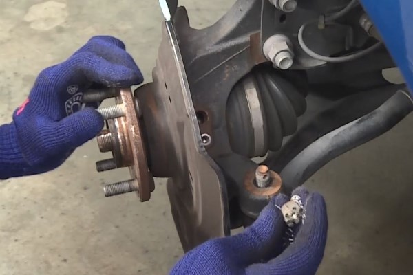 Wheel Bearing Replacement - In case the nut is rotating with the ball joint, press the ball joint further into the knuckle arm