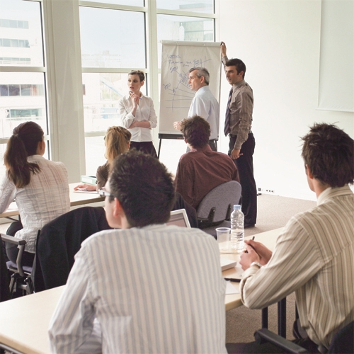 Professionals attending a trade training course